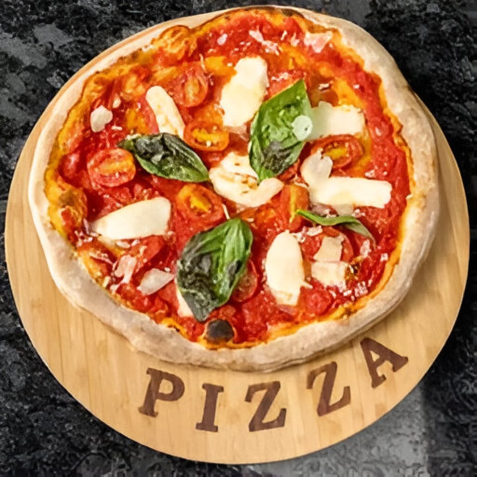 Bella Ciao's pizza with tomato sauce, fresh mozzarella, basil, and cherry tomatoes on a wooden board.